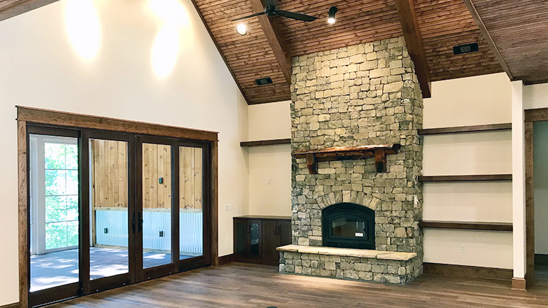 Custom home living room with stone fireplace