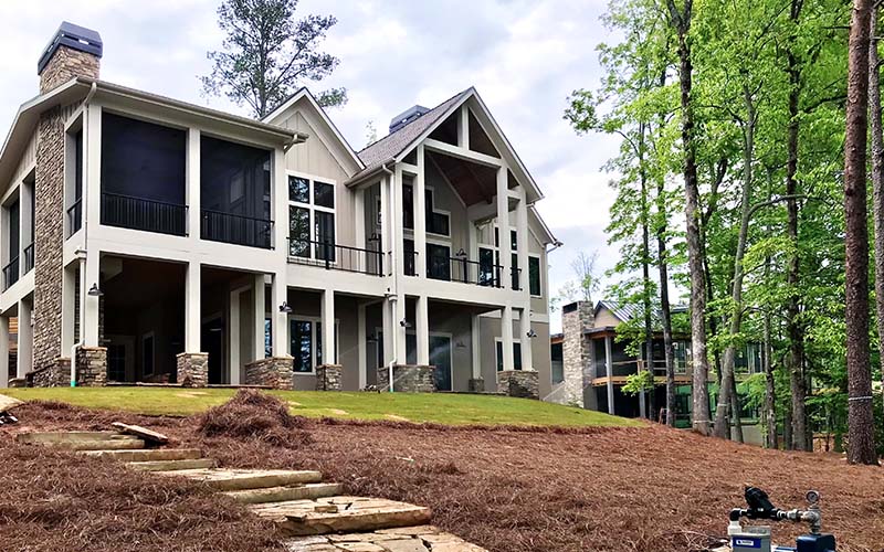 Rear view of a custom built home looking out ovr Lake Keowee